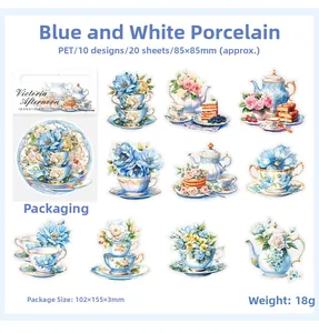 Macro detail of Victorian PET stickers featuring blue porcelain tea sets and flowers