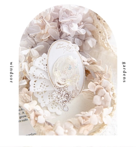 Detail of elegant 3D embossed floral stickers with pearl and sequin accents