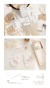 Close-up of vintage aesthetic stickers with botanical illustrations and retro craft box