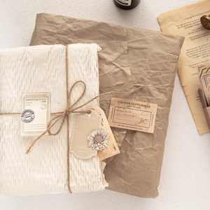Retro aesthetic packaging kit with honeycomb paper kraft wrap and vintage gift tags