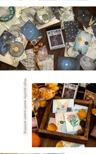 Close-up of vintage washi paper stickers with retro botanical and celestial art prints
