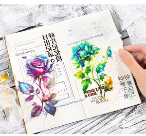 Detail of floral PET stickers with shell light effect and romantic slogans on a journal page