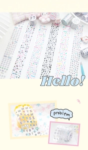 Detailed view of colorful decorative alphabet washi tape with cute scrapbook accessories