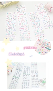 Close-up of pastel macaron-colored alphabet and number stickers for journaling decoration