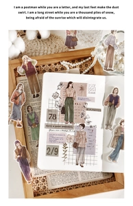 Detailed stickers showing hand-drawn female characters for journal decoration on a desk