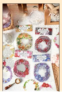 Detailed flat lay of floral PET deco stickers with vintage accessories for scrapbooking