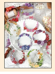 Floral PET stickers featuring roses and sunflowers on a white plate with vintage props