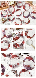 Detailed view of vintage floral wreath stickers with roses and butterflies on retro paper