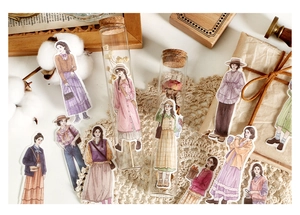 Detailed view of hand-drawn vintage style female stickers for scrapbooking and craft decor