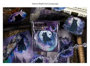 Detailed view of vintage starry night cat stickers set on a decorative background