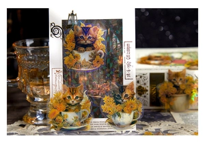 Detail of laser-finish cat in teacup stickers on a decorative white layout card