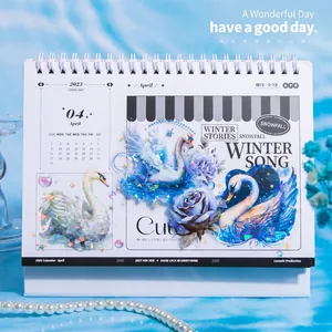 2023 desk calendar with swan theme, laser stickers, blue floral design and twin-wire binding