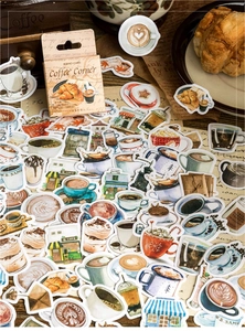 Macro shot of retro watercolor coffee stickers with croissant and vintage grinder props