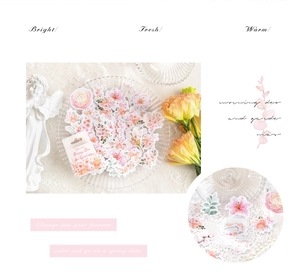 Detail showing floral scrapbooking stickers with roses and lilies in garden theme