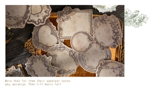 Vintage decorative paper label set featuring baroque floral patterns on aged background