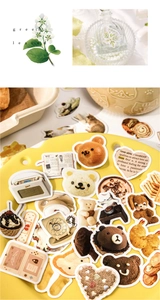 Macro detail of aesthetic coffee-themed decorative stickers for DIY scrapbooking