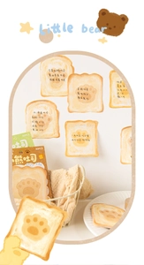 Close-up of cute bear paw print toast-shaped sticky notes for DIY scrapbooking