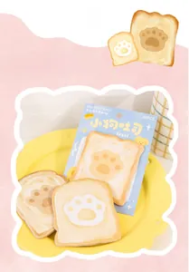 Detailed view of cute dog paw toast memo pads in a yellow dish for scrapbooking