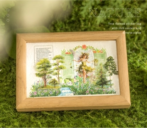 Detail of forest themed PET stickers in a wooden frame with trees and nature motifs