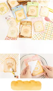 Detail of cute toast-shaped sticky notes with animal paw prints for scrapbooking