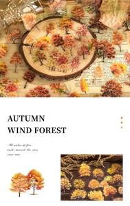 Macro detail of autumn tree stickers on vintage paper for DIY scrapbooking decoration