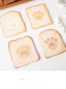 Detailed view of cat paw shaped toast sticky notes in four different patterns