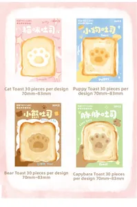 Macro detail of toast-shaped animal paw sticky notes with unique die-cut edges