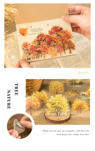 Vintage PET stickers featuring golden trees, deer, and autumn leaves on a DIY journal page
