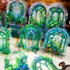 Holographic vintage European window stickers for scrapbooking on an old book background