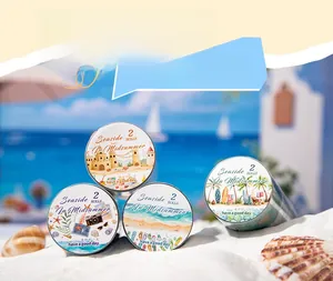 Detail showing two rolls of Seaside In Midsummer decorative tapes with beach sandcastle theme