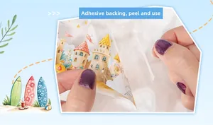 Detail of self-adhesive floral scrapbooking sticker being peeled for DIY decoration
