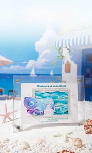 Detail of 3D layered acrylic seaside card decor with anime girl on white beach sand