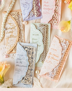 Detailed laser-cut lace paper with intricate floral patterns for vintage DIY scrapbooking