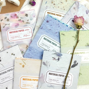 Textured material paper with dried floral patterns for DIY scrapbooking and journal decor