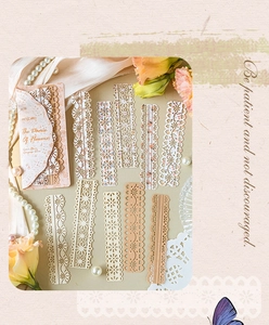 Detailed close-up of vintage die-cut lace paper strips for elegant DIY scrapbooking decor