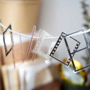 Vintage movie film PET stickers with transparent frames and retro slides on white string