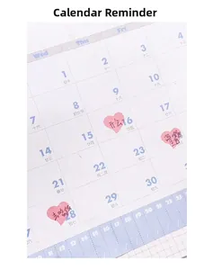 Close-up of pastel dot stickers used on a minimalist calendar planner for decoration