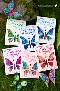 Fairy wings PET stickers with shell luster finish displayed on green forest moss