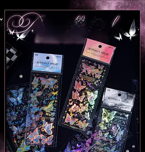 Close-up of laser gold foiled butterfly stickers with holographic effect for scrapbooking