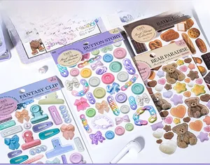 Macro shot of 2PCS aesthetic lifestyle stickers with Bear Paradise and Button motifs