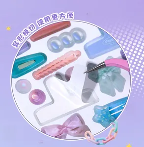 Detail of multi-shaped pastel stickers and tweezers for DIY scrapbook decoration