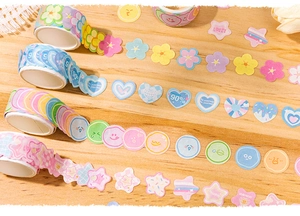 Macro detail of cute pastel flower and heart shaped washi tape stickers for journaling