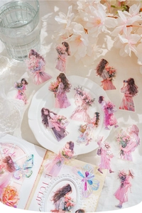 Close-up of elegant floral girl PET stickers on white lace with decorative books