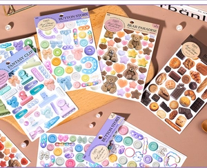 Detailed close-up of aesthetic INS lifestyle stickers featuring bear and bakery themes