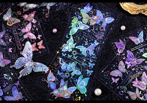 Detail showing laser gold butterfly stickers with iridescent effect for DIY journaling