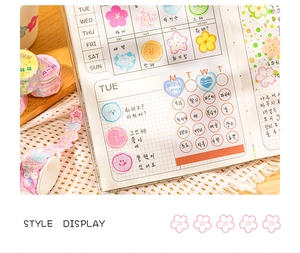 Close-up of cute Korean style floral and heart stickers on a scrapbooking journal page