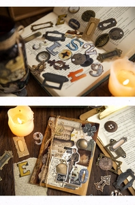 Detailed view of vintage scrapbook stickers featuring metallic gears and retro labels