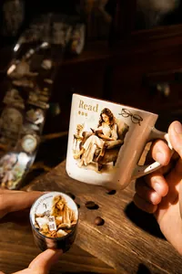 Detail of vintage hand-drawn washi tape with reading theme applied on a ceramic mug