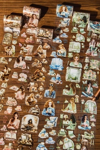 Macro detail of vintage hand-drawn pet tape with coffee and reading theme on wood