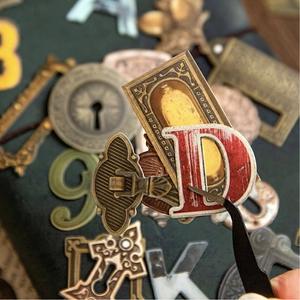 Retro industrial scrapbooking stickers featuring vintage alphabets and architectural metal hardware